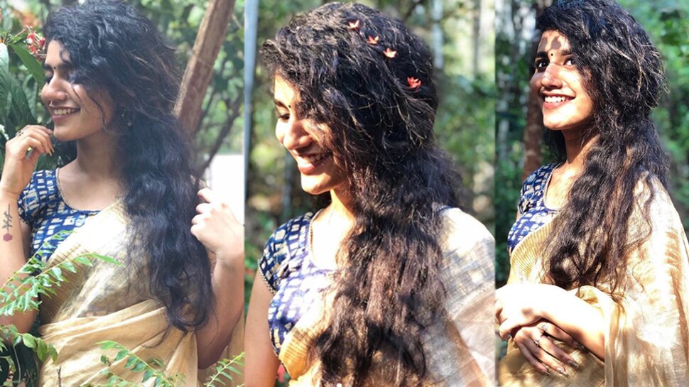 See Pics: സാരിയുടുത്ത് മുടിയില് പൂ ചൂടി, തനി നാടനായി പ്രിയ വാര്യര് See Pics: സാരിയുടുത്ത് മുടിയില് പൂ ചൂടി, തനി നാടനായി പ്രിയ വാര്യര്