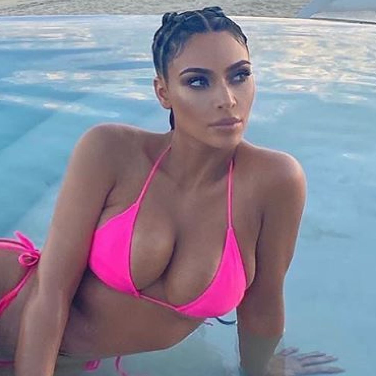 Kim Kardashian Flaunts Her Curves In A Hot Pink Bikini