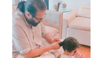 Father&#039;s Day : Mammootty കൊച്ചു മകൾ മറിയത്തിന് മുടി കെട്ടി നൽകുന്നു, ചിത്രത്തിനൊപ്പം താരത്തിന്റെ ലുക്കും വൈറൽ