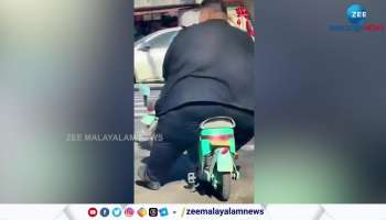 big fat man riding scooter