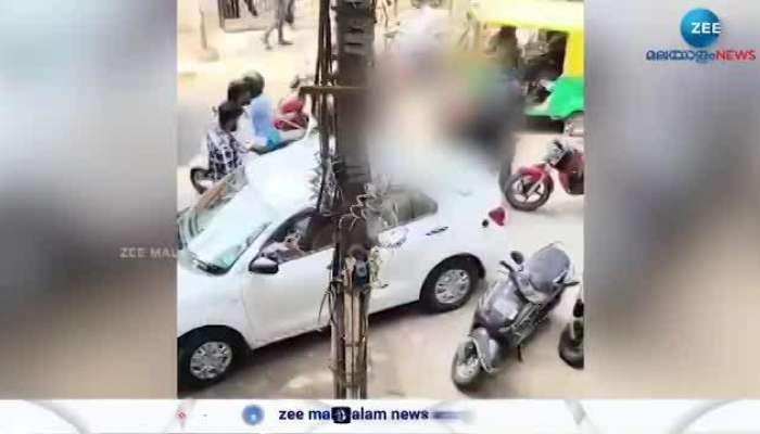 Woman beats young men in middle of road over parking issue in Bangalore